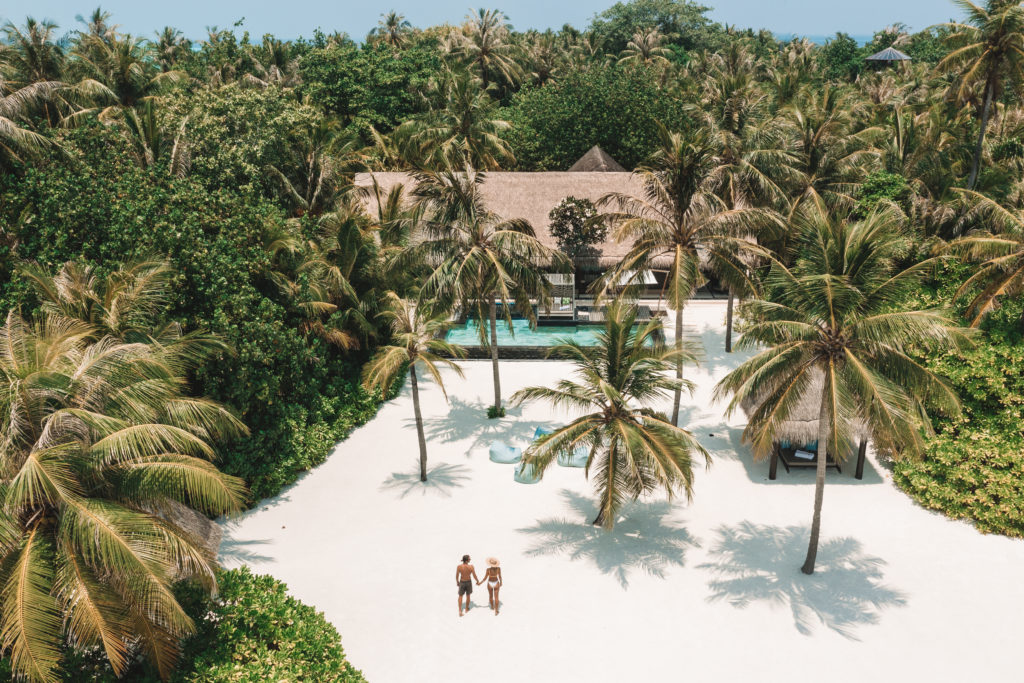 couple on the beach at one & only reethi rah