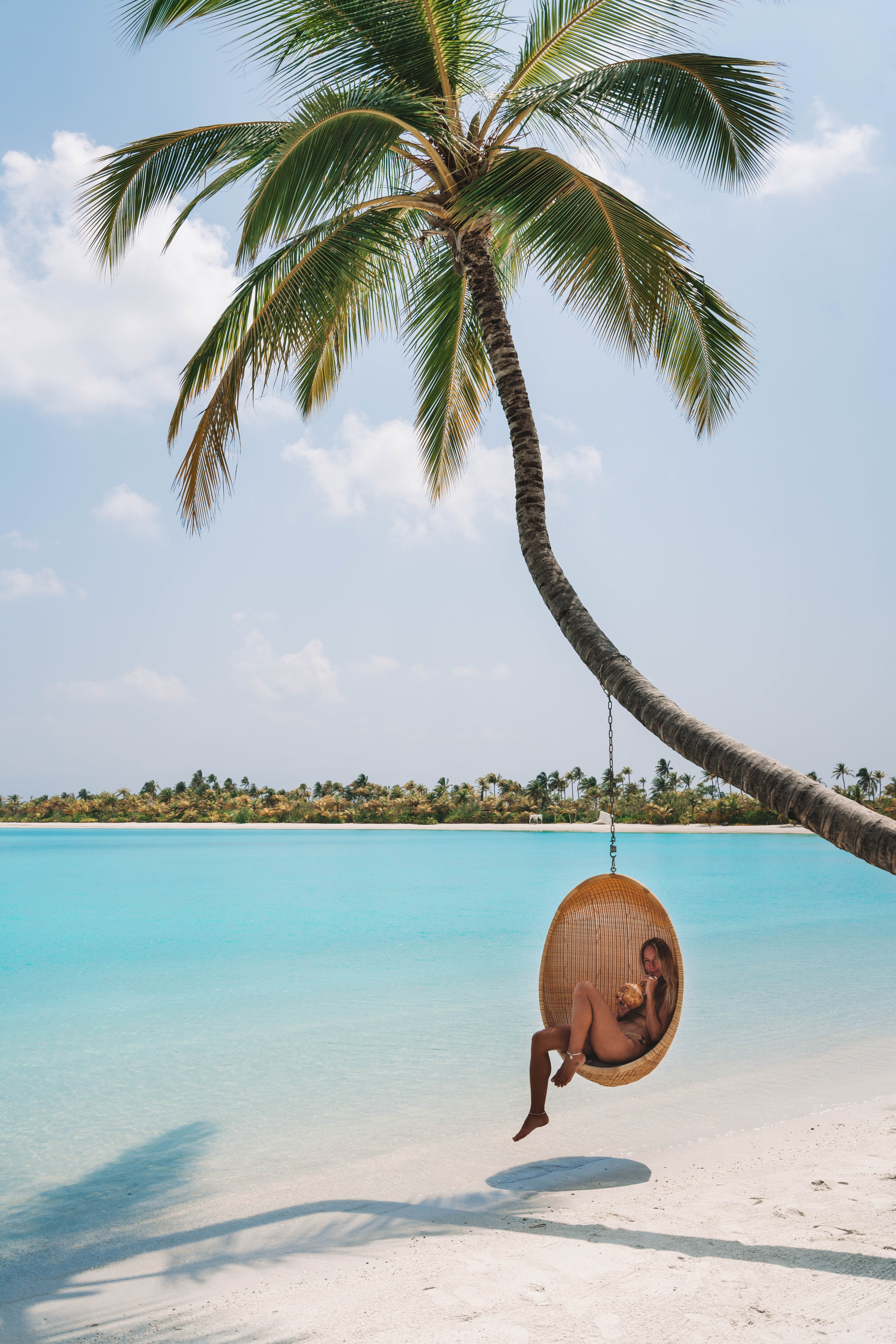 Salty Luxe in a beach swing at Patina Maldives