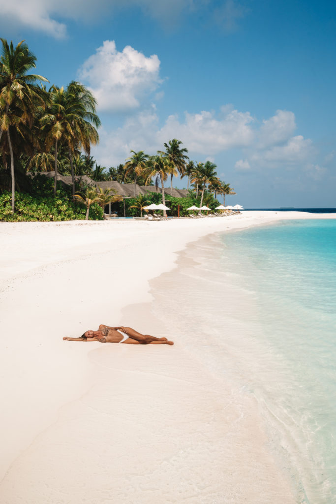 Salty Luxe laying on the white sands of baglioni maldives