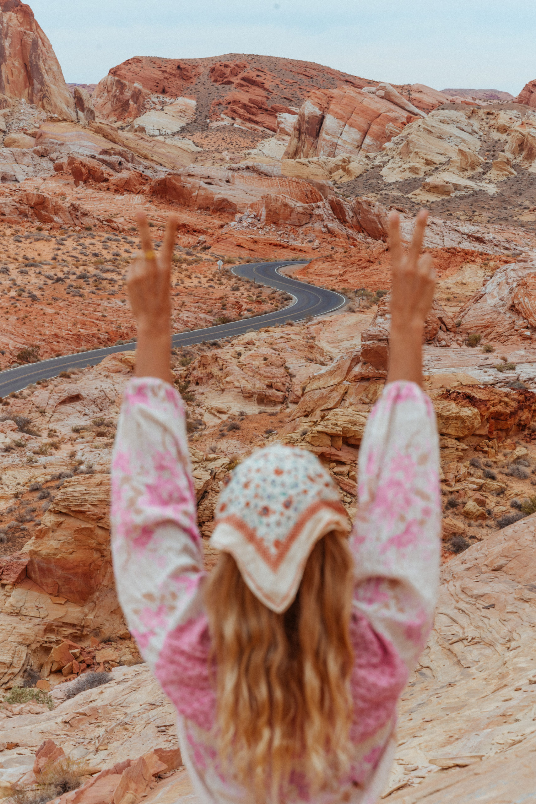 Sarah holding up arms overlooking the Valley of Fire Park