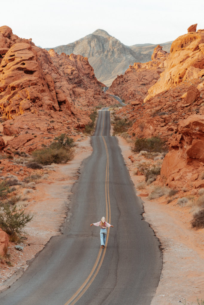 Sarah running along road at the Valley of Fire Park