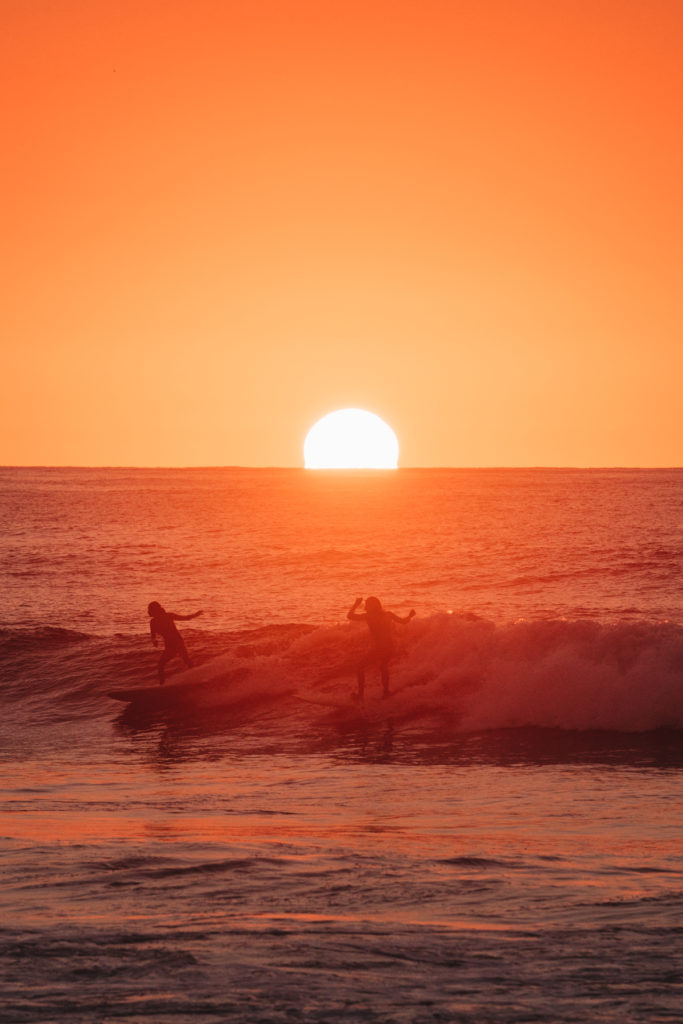 Surfing at sunset in San Pancho