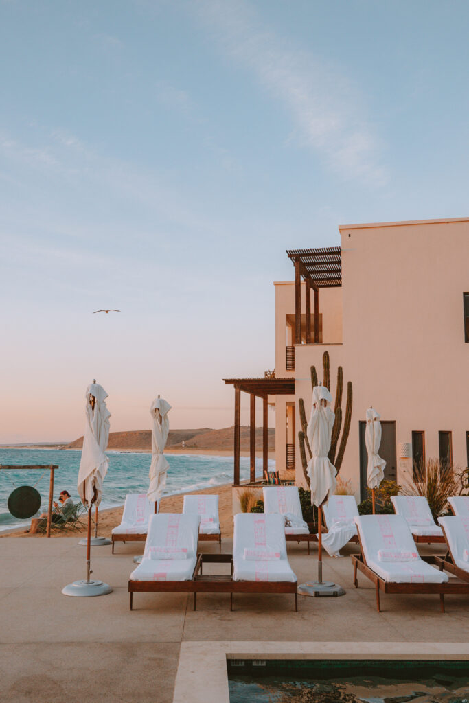 San Christobal Hotel poolside lounge chairs and ocean beyond
