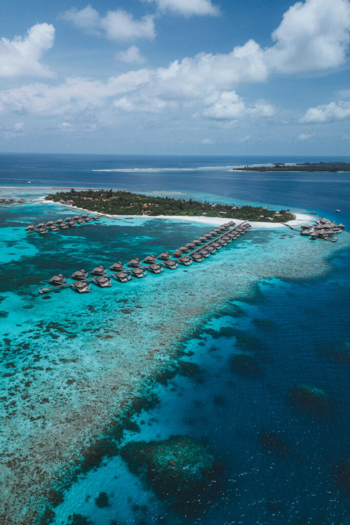 Aerial image of Six Senses Resort, showing the surrounding coral reef