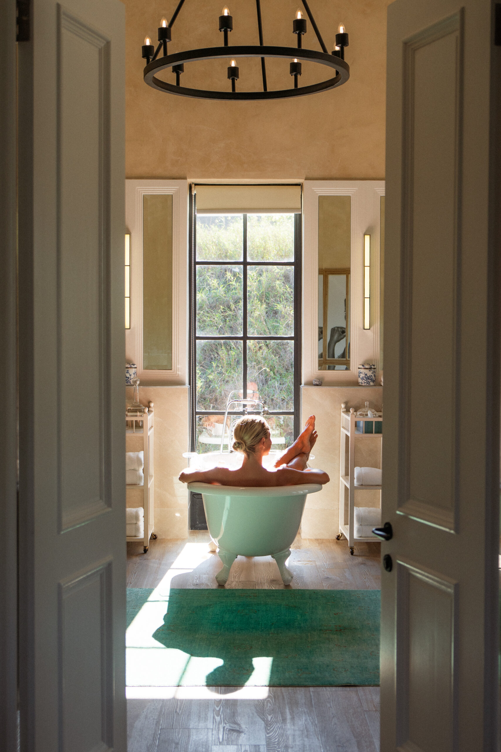 salty luxe relaxing in a bathtub in farmhouse at farmstead lodge