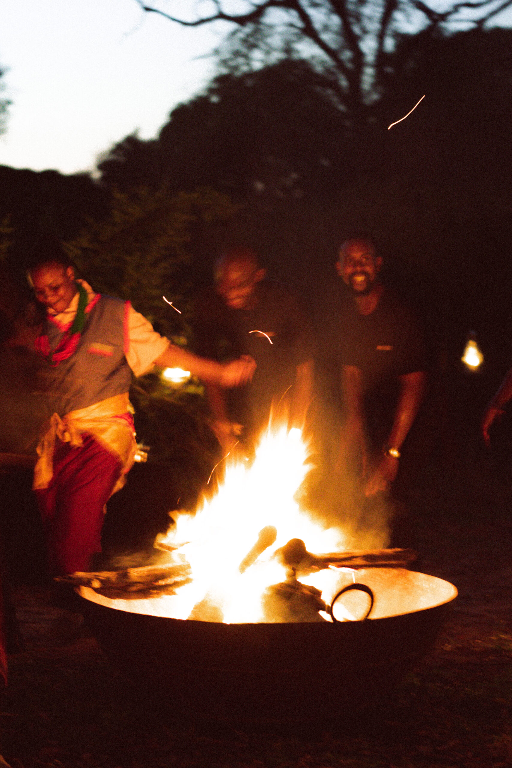 guides dancing around a fire at royal malewane