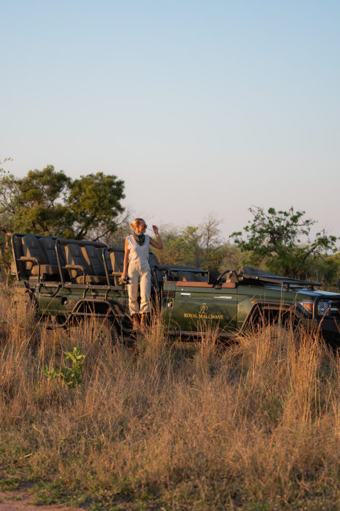 salty luxe standing up on the side of a safari vehicle in kruger national park