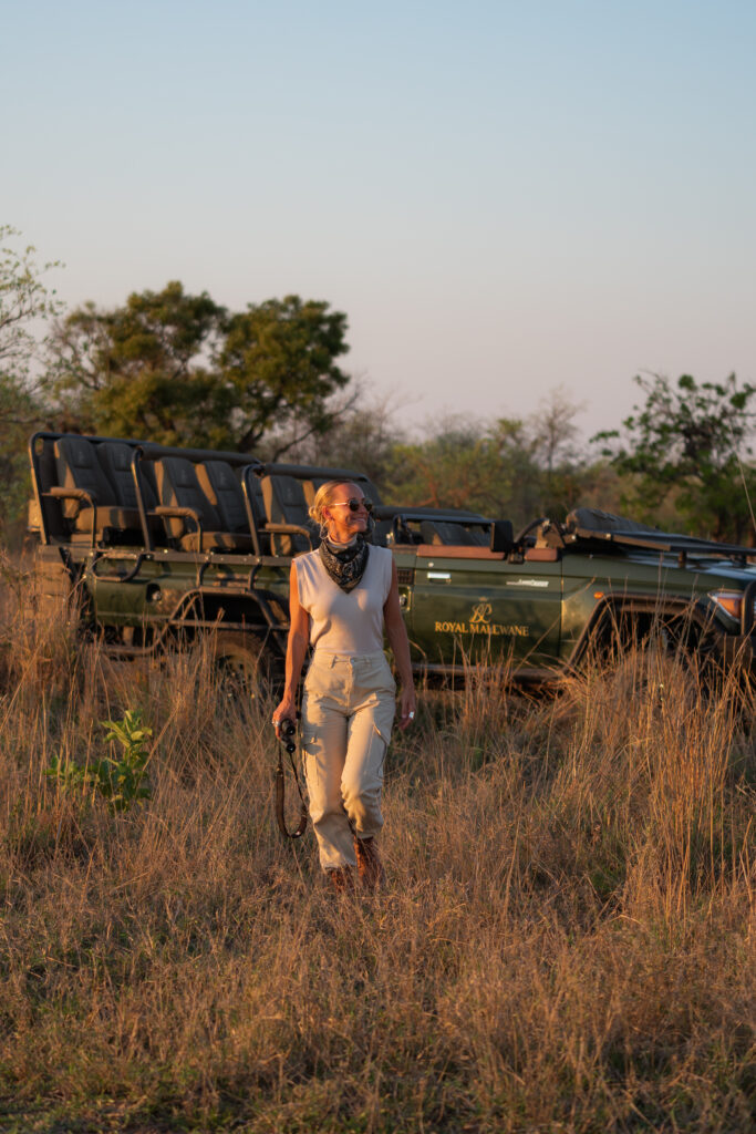 salty luxe walking away from a safari vehicle with royal malewane