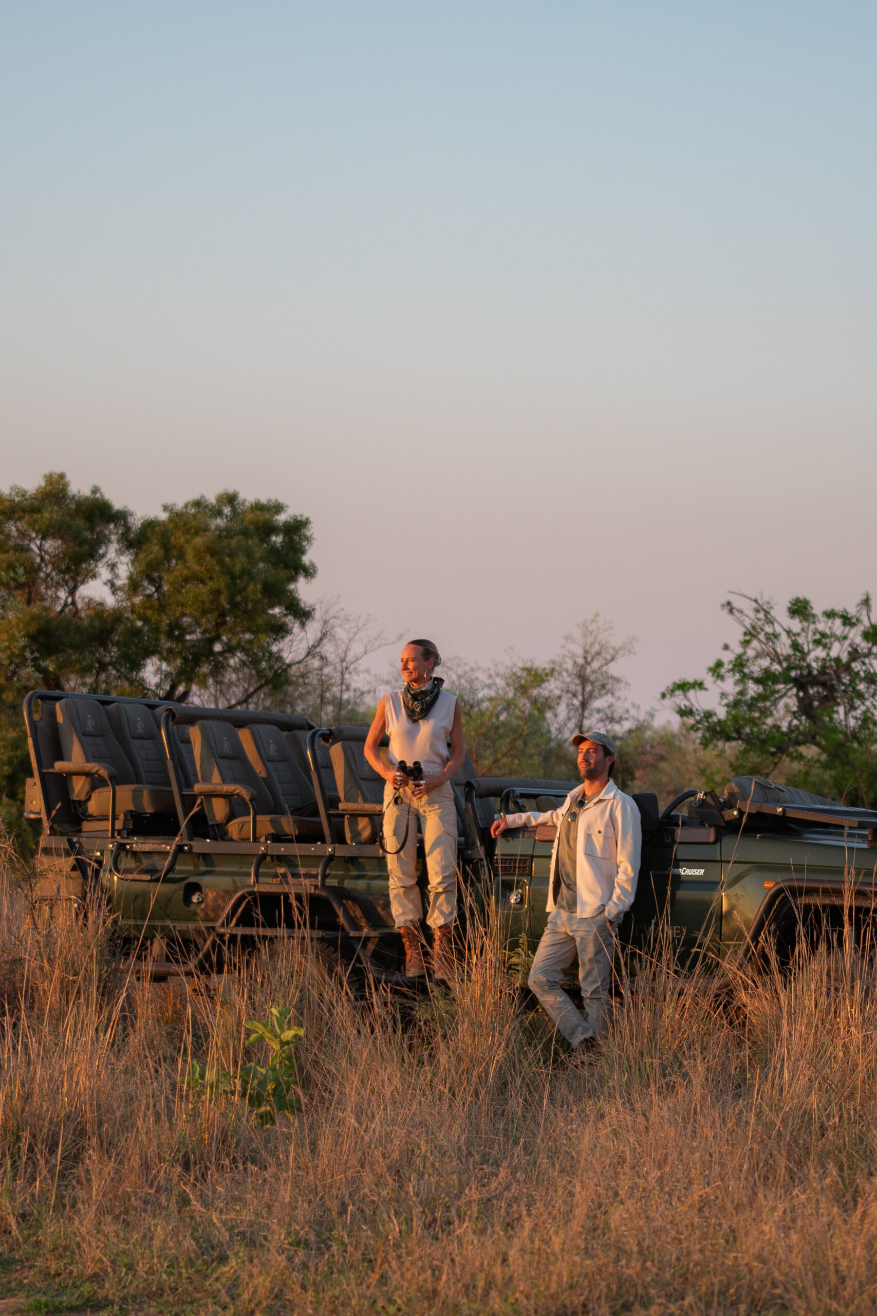 a couple looking out over kruger national park from a royal malewane safari vehicle