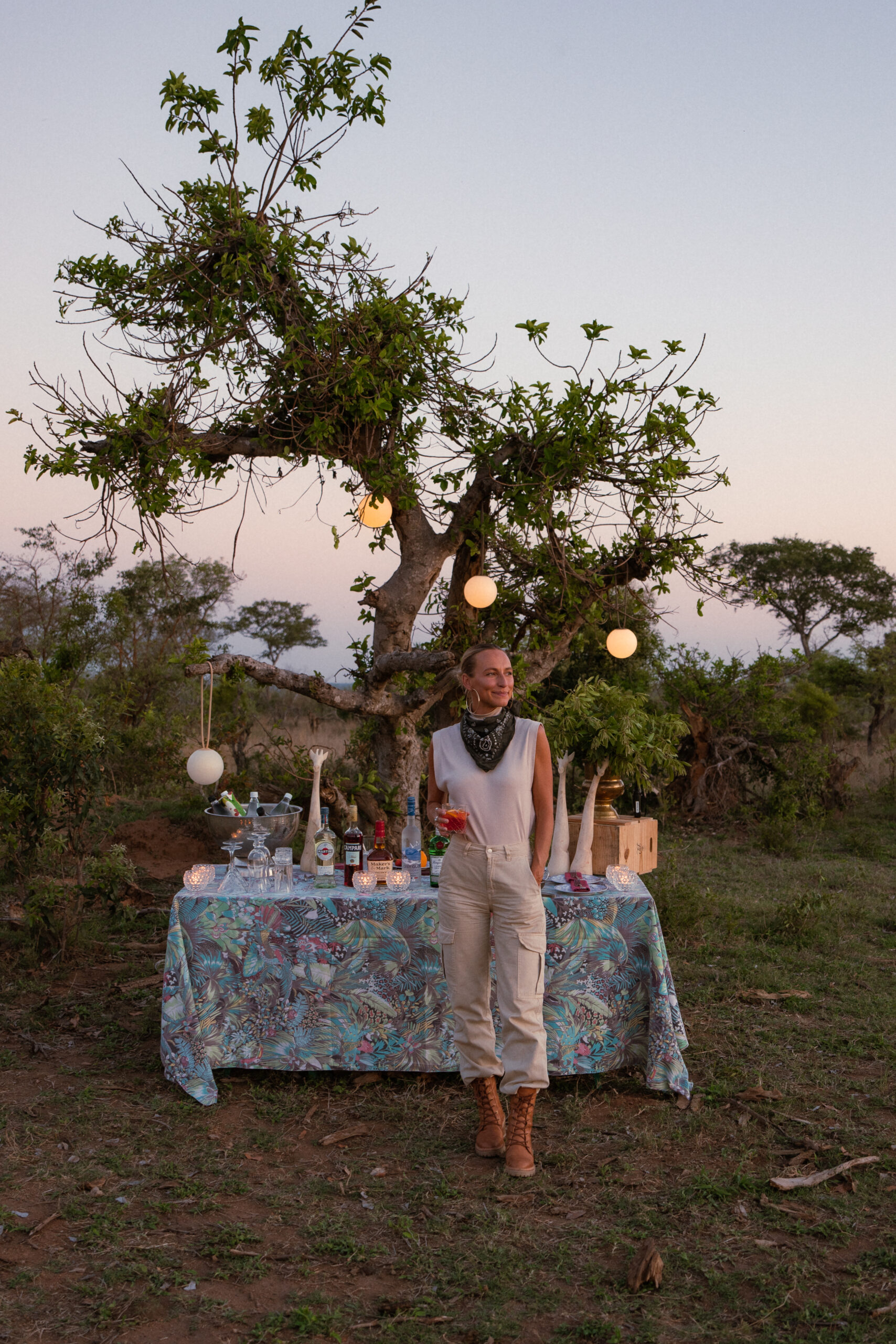 salty luxe in front of a sundowner setup on safari in kruger national park