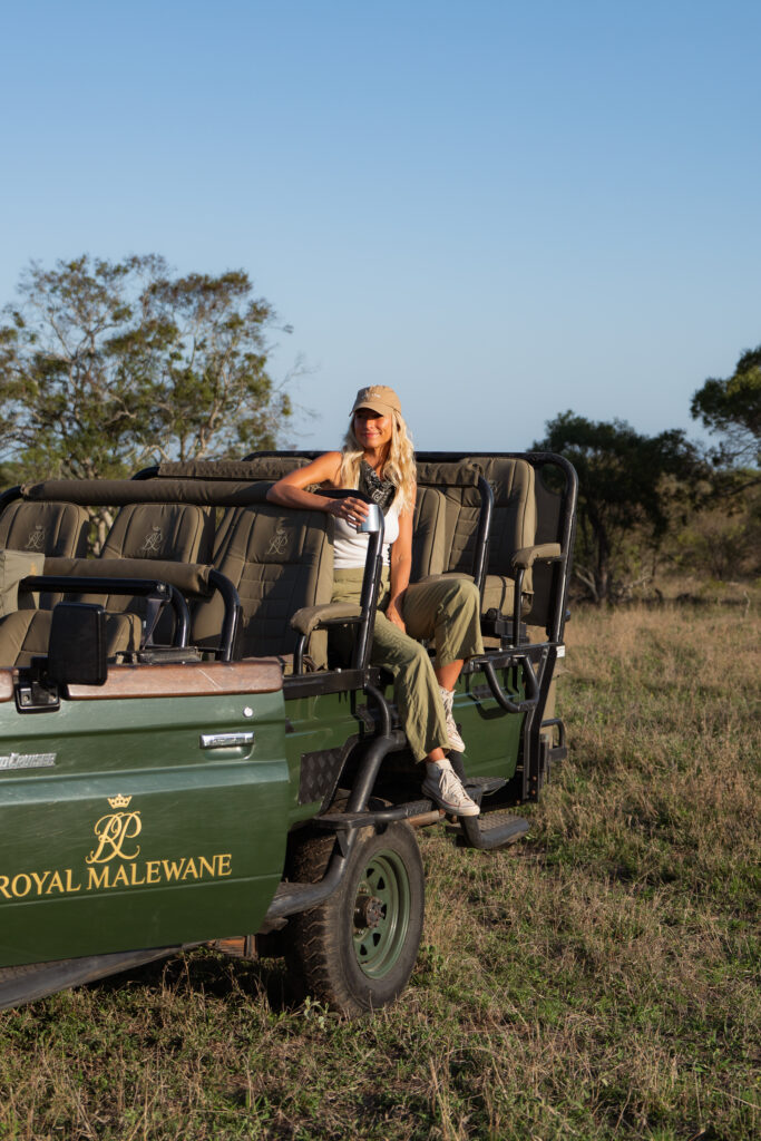 salty luxe sitting in a royal malewane game drive vehicle