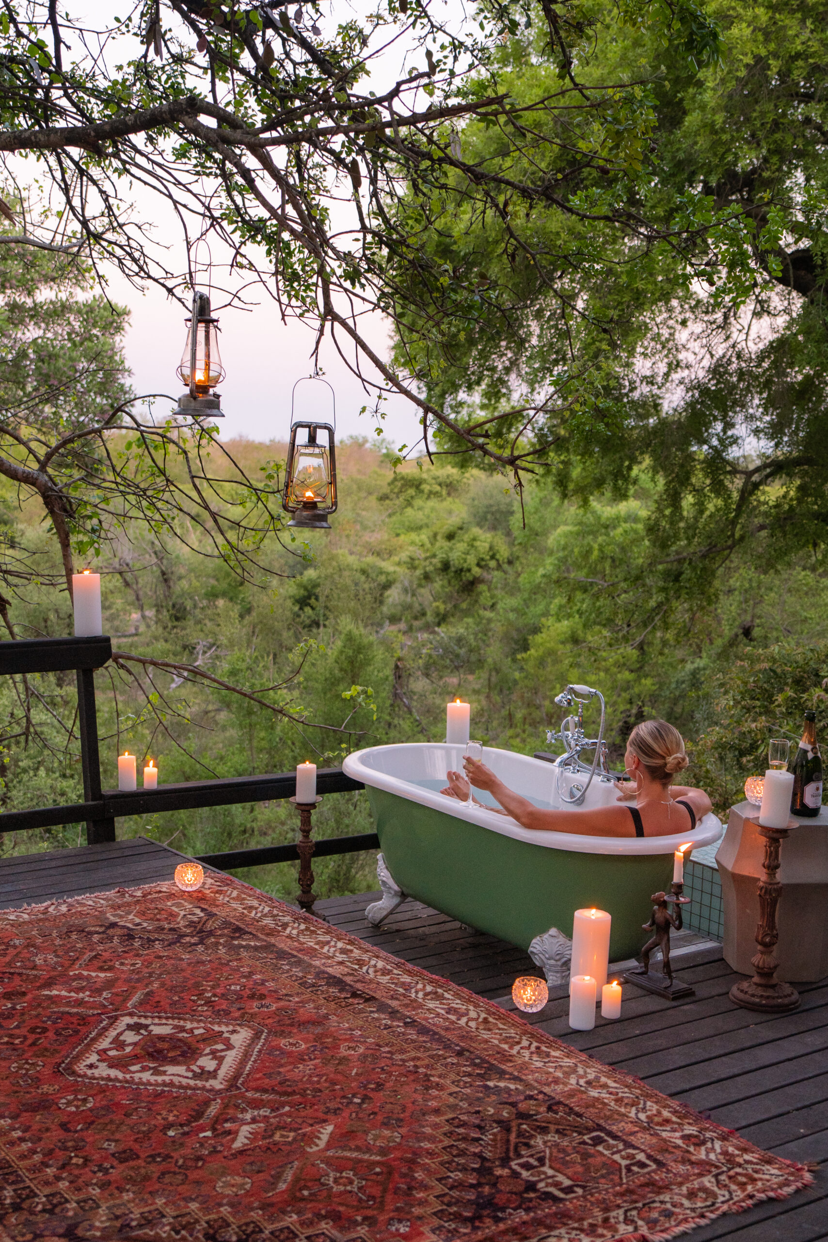 salty luxe relaxing in a tub overlooking the african bush at royal malewane south africa