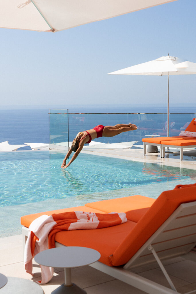 woman diving into the pool at the maybourne riviera