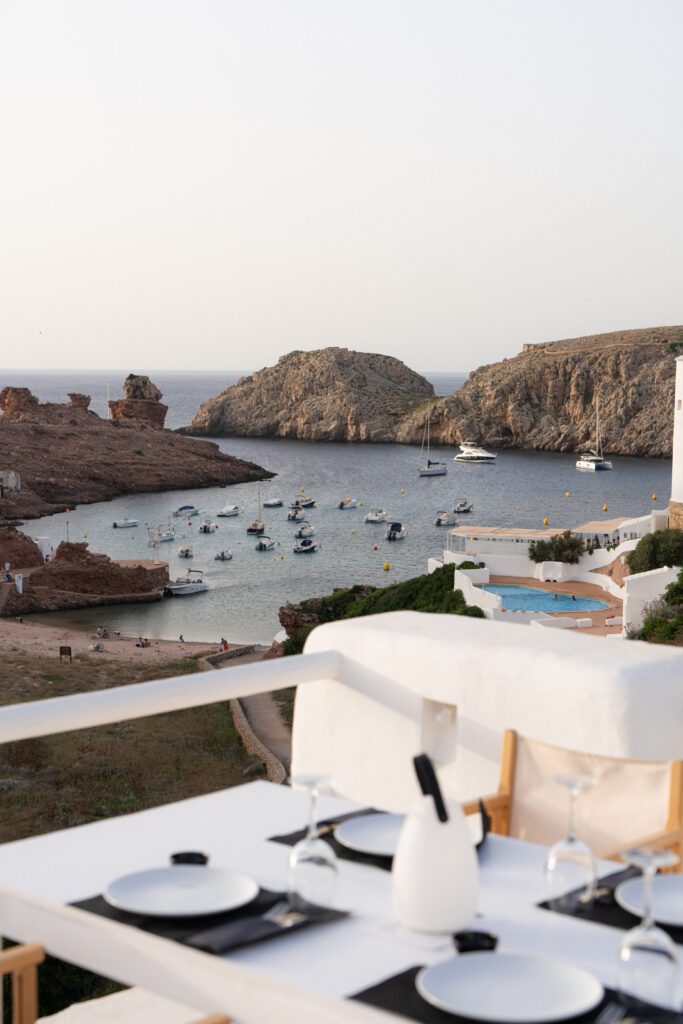 view from a table at enricana in menorca overlooking the water