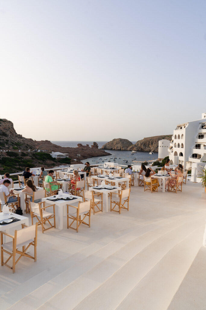 people dining at enricana menorca overlooking the Mediterranean sea