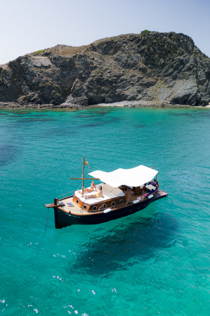 A traditional wooden boat tour in Menorca