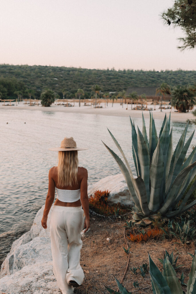 salty luxe walking along the coast of Six Senses Kaplankaya