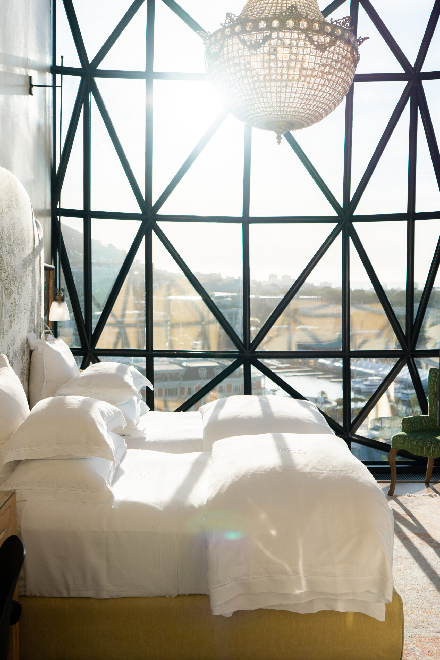 bedroom in the silo hotel with a chandelier in front of the window