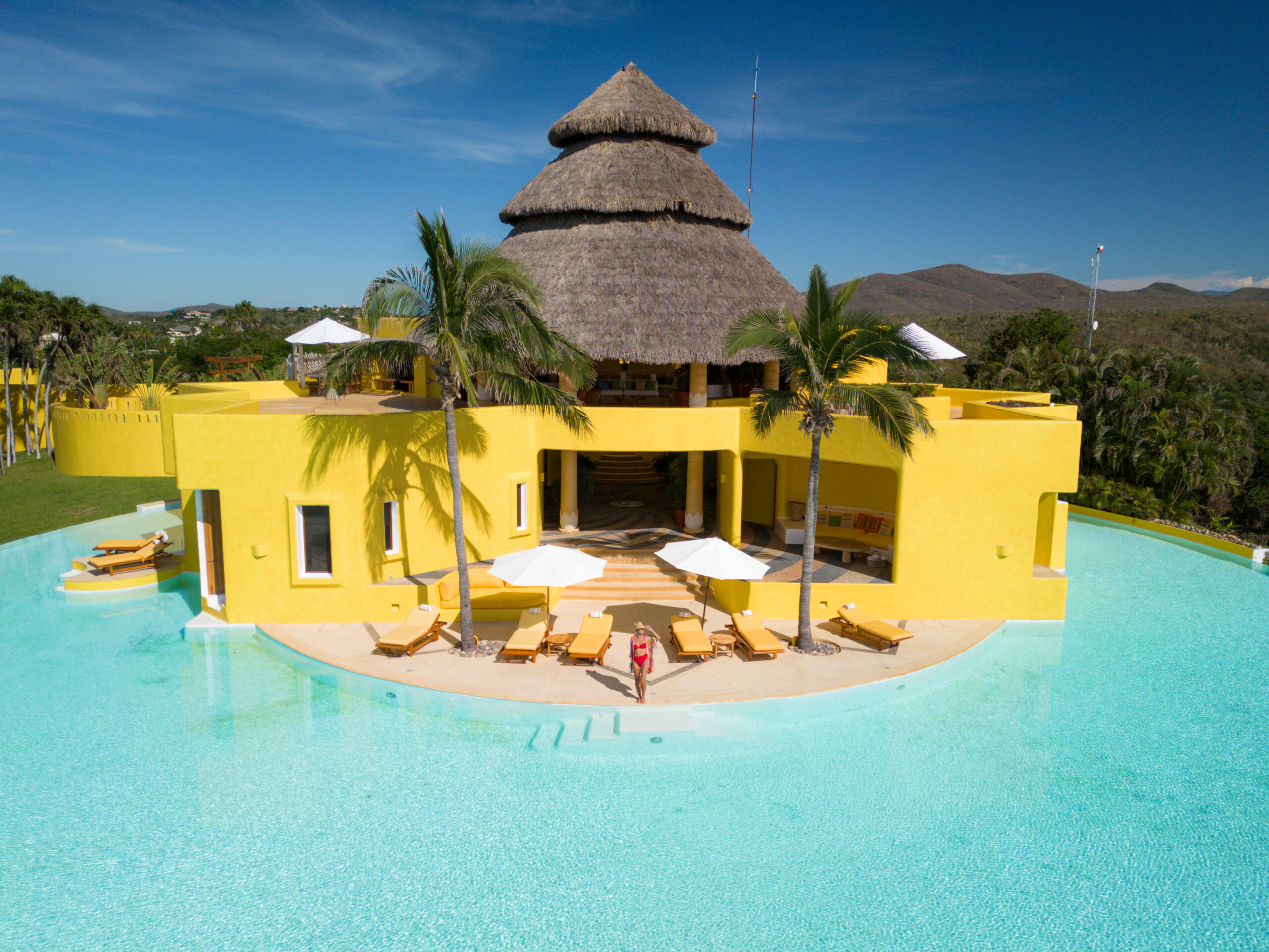 salty luxe wading into the pool at costa careyes mexico villas