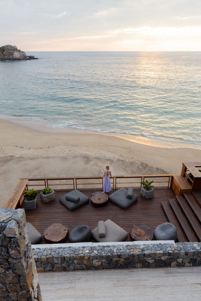 salty luxe enjoying a drink at sunset at four seasons tamarindo overlooking the hotel beach