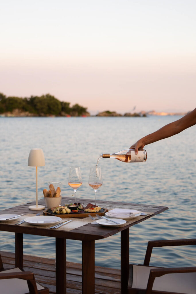 a glass of wine being poured at Grecotel Corfu Imperial